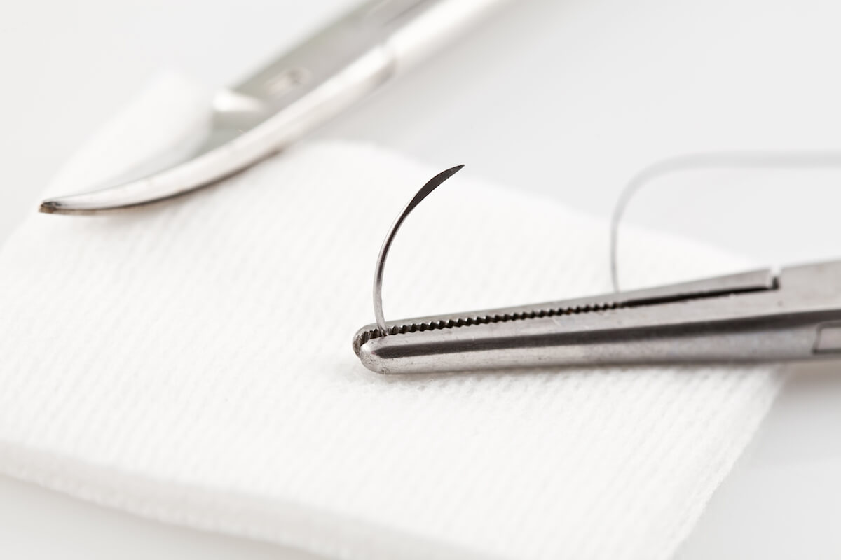 Surgical Silk suture and scissors